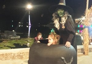 Witch and Child at Lake Winnie During Halloween